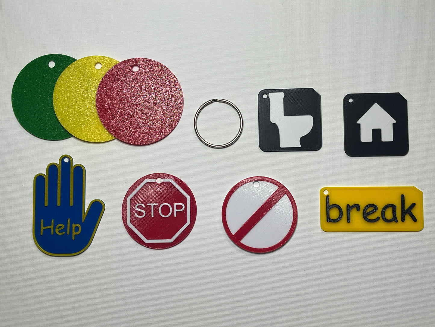Close-up of lanyard set symbols showing tactile raised detail for VI users