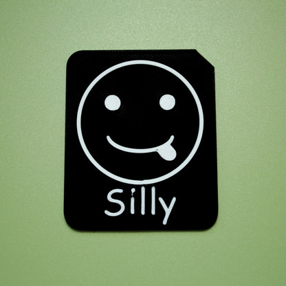 Silly tactile tile - 3D printed raised symbol showing worried face for AAC and SEND communication with vocabulary