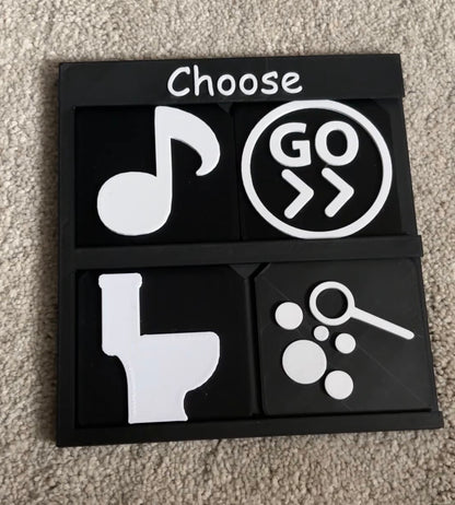 2x2 Choose Board holding four tactile tiles for AAC and SEND choice making support