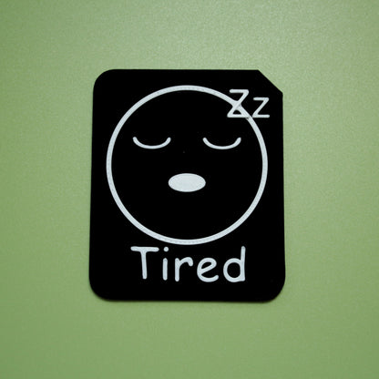 Tired tactile tile - 3D printed raised symbol showing angry face for AAC and SEND communication with vocabulary
