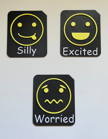 Large format tactile tile showing excited face symbol in yellow Zones of Regulation colour