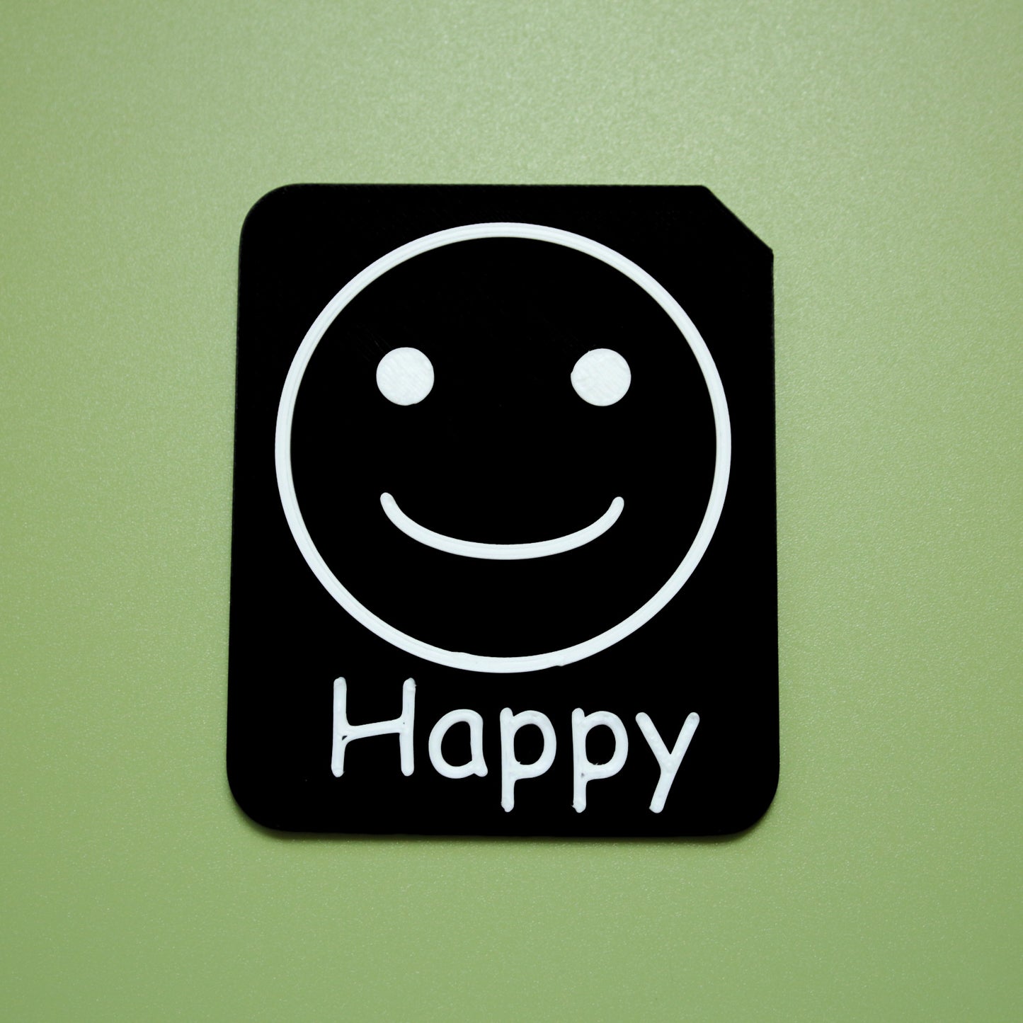 Happy tactile tile - 3D printed raised symbol showing happy face for AAC and SEND communication with vocabulary