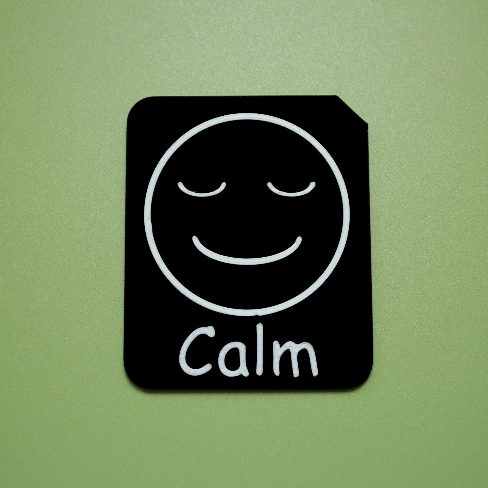 Calm tactile tile - 3D printed raised symbol showing excited face for AAC and SEND communication with vocabulary