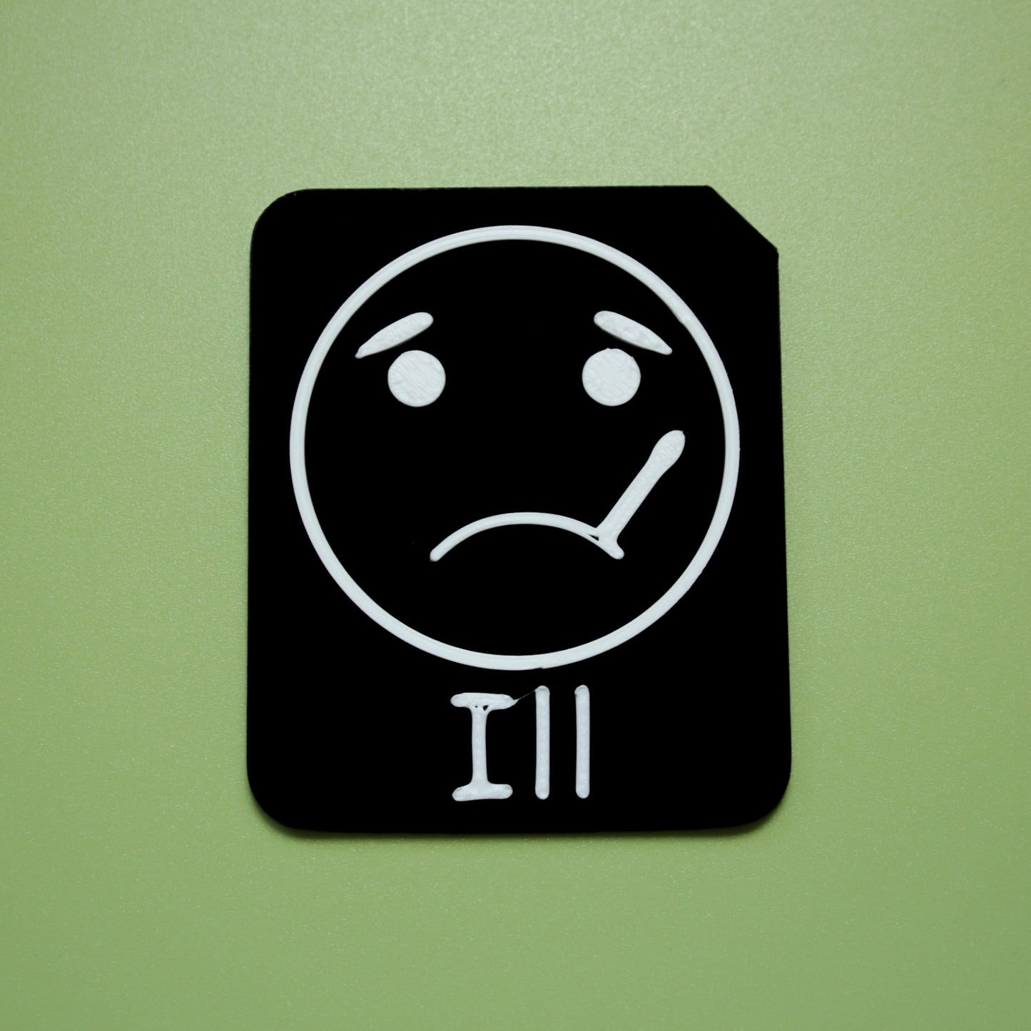 Ill tactile tile - 3D printed raised symbol showing shocked face for AAC and SEND communication with vocabulary