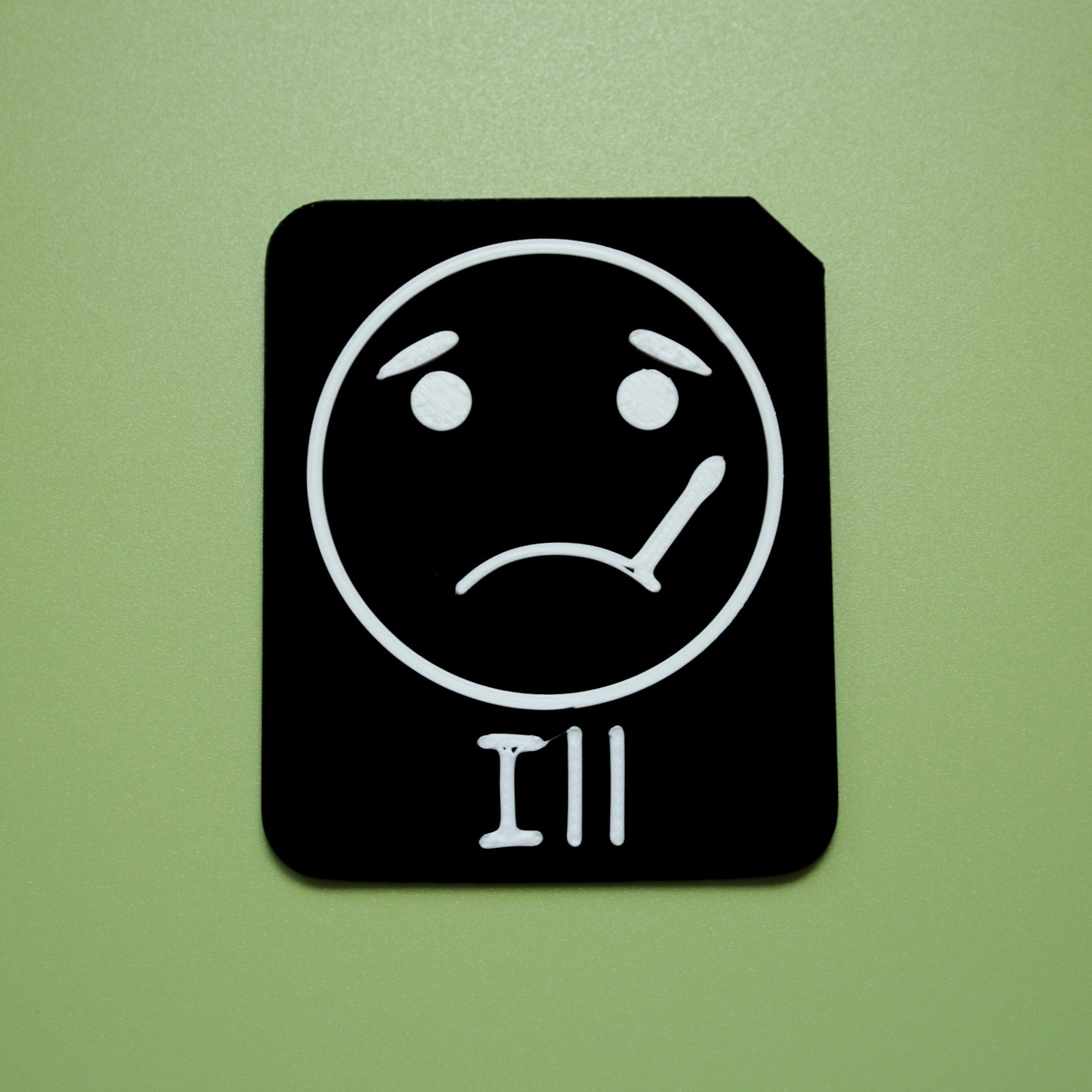 Ill tactile tile - 3D printed raised symbol showing shocked face for AAC and SEND communication with vocabulary