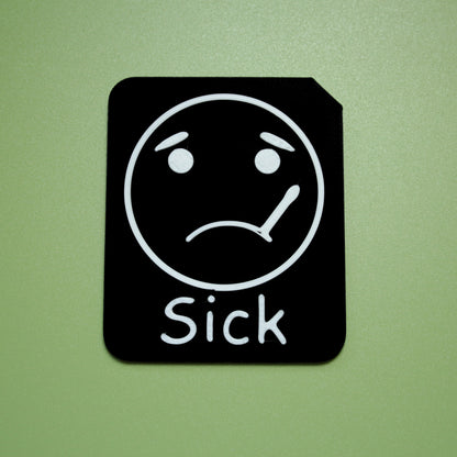 Sick tactile tile - 3D printed raised symbol showing bored face for AAC and SEND communication with vocabulary