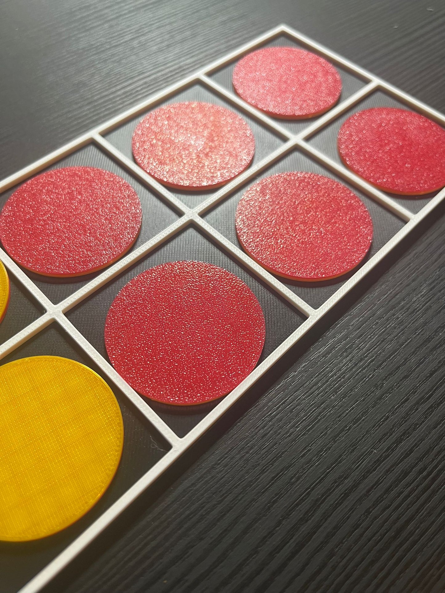 Close-up of tactile ten frame showing raised grid for touch-based counting and maths