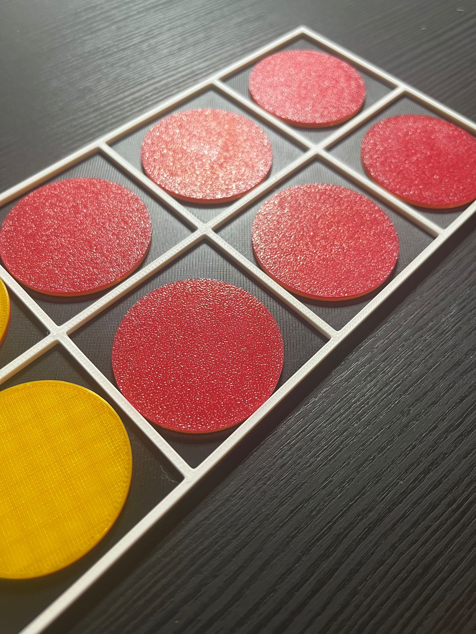 Close-up of tactile ten frame showing raised grid for touch-based counting and maths
