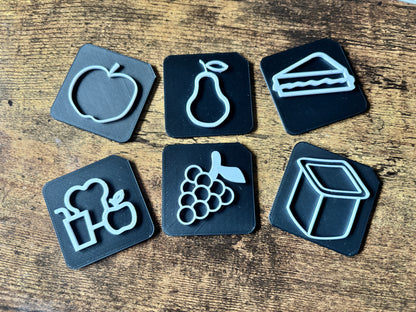 Tactile tile showing raised symbol surface for touch-based communication