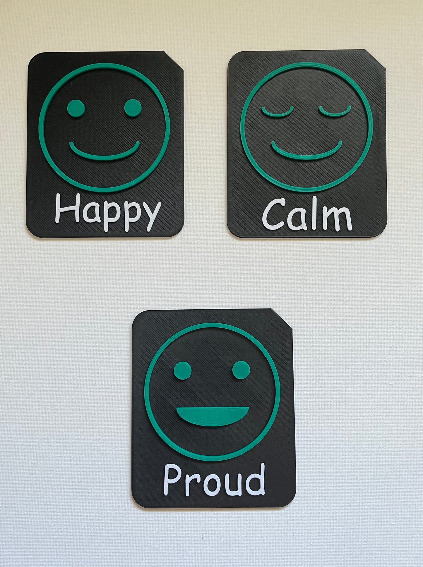 Large tactile tile showing surprised face for emotions communication support