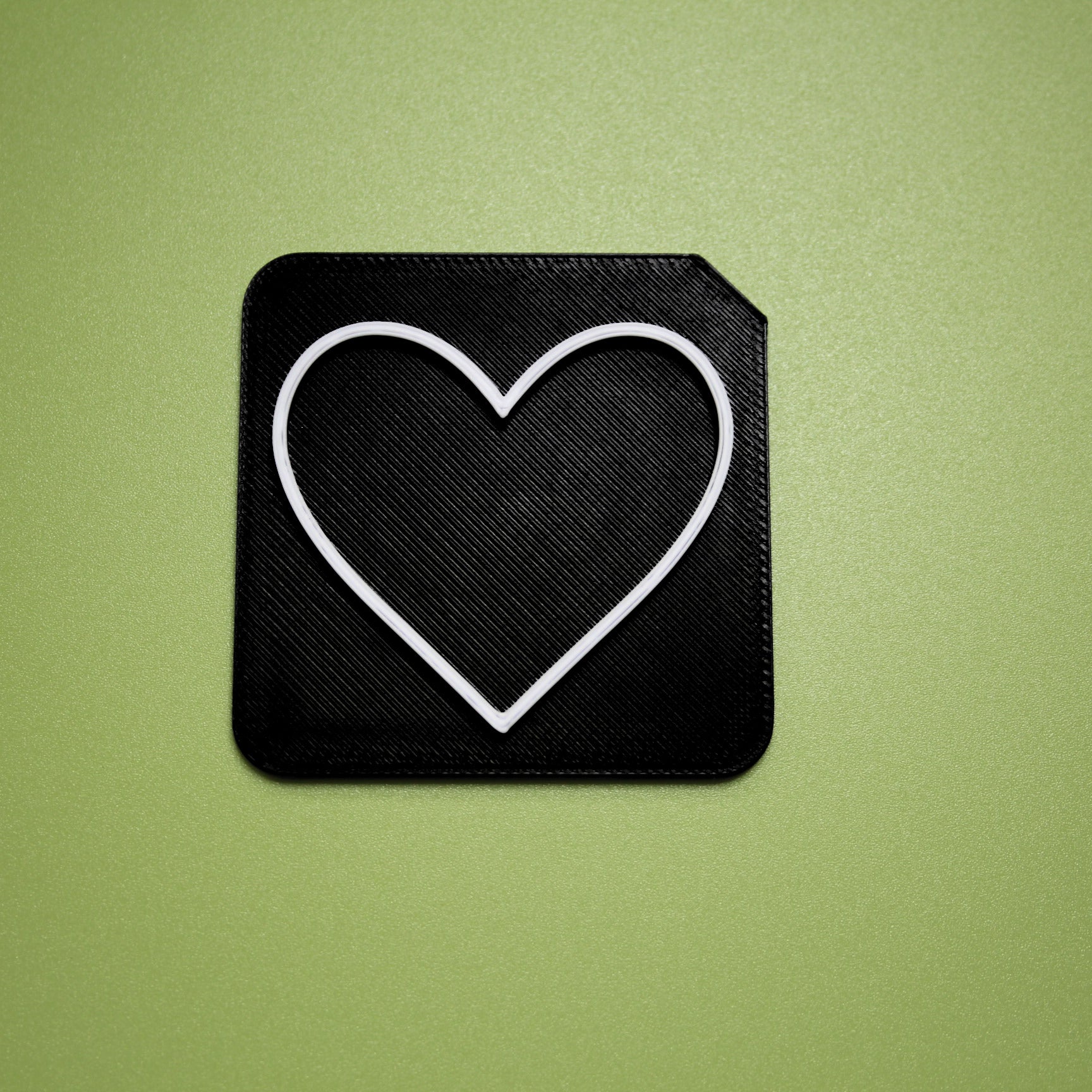 Love tactile tile - 3D printed raised symbol showing love heart for AAC and SEND communication