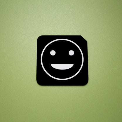 Proud tactile tile - 3D printed raised symbol showing proud face for AAC and SEND communication