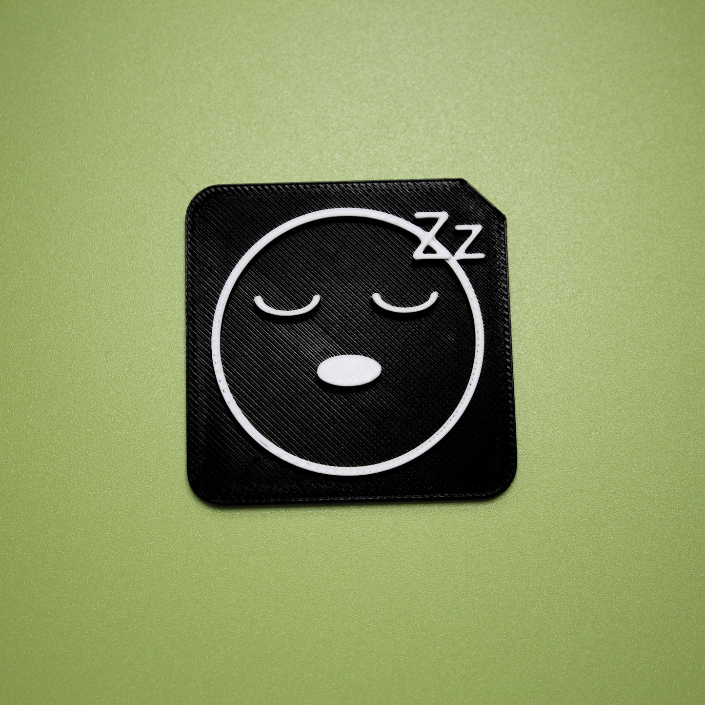 Tired tactile tile - 3D printed raised symbol showing tired face for AAC and SEND communication
