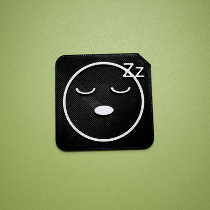 Tired tactile tile - 3D printed raised symbol showing tired face for AAC and SEND communication