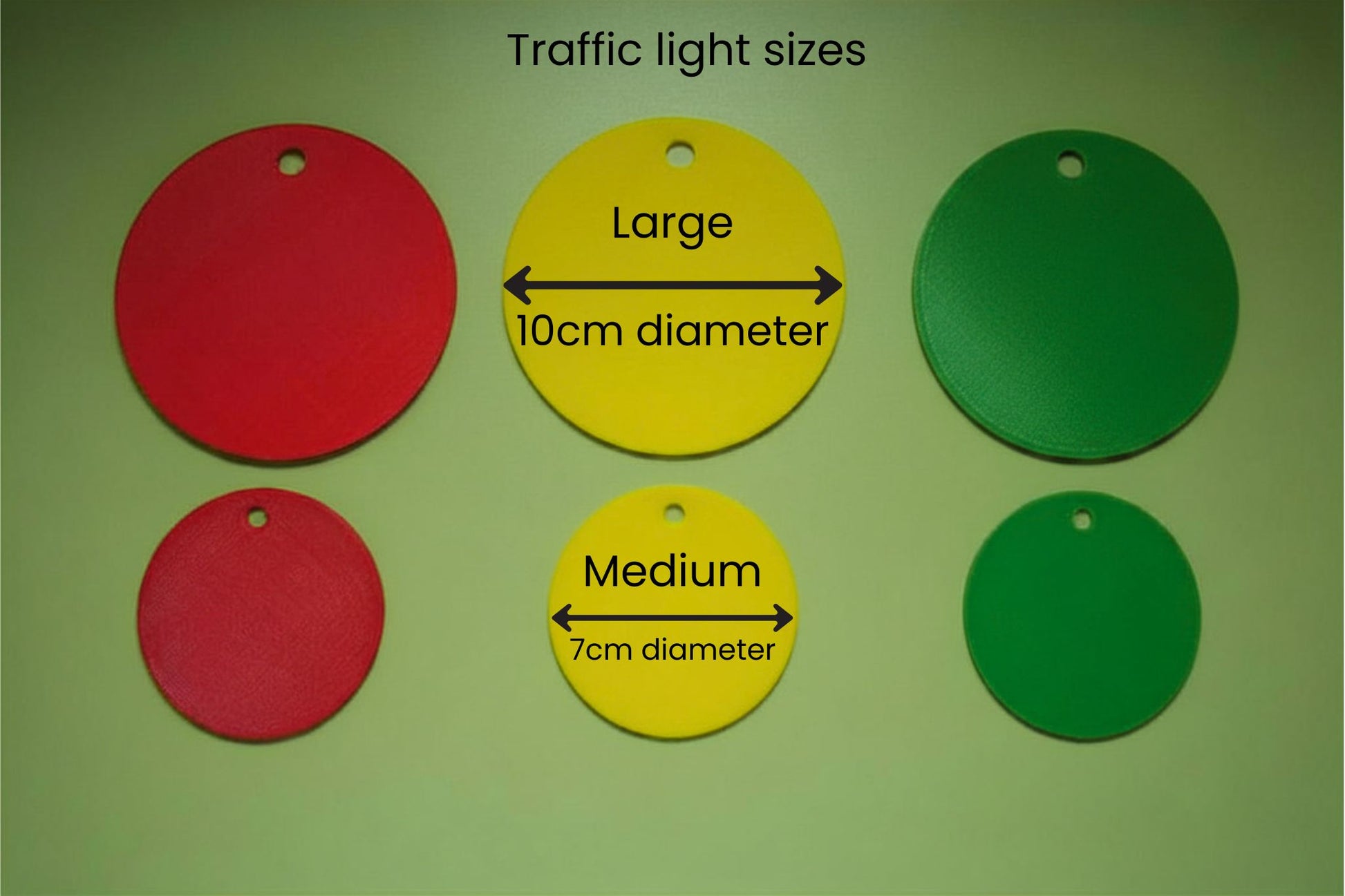 Three traffic light discs clipped to a lanyard for classroom behaviour regulation