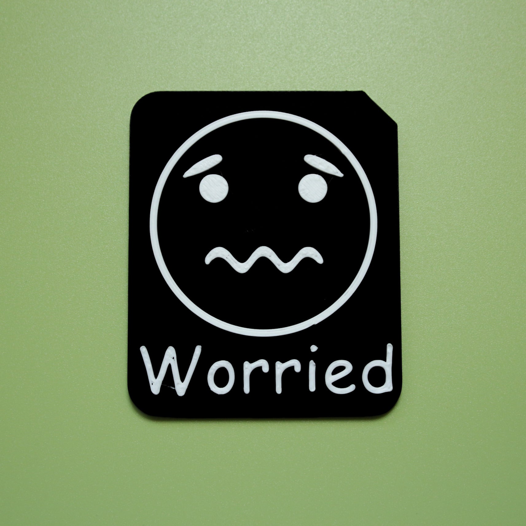 Worried tactile tile - 3D printed raised symbol showing calm face for AAC and SEND communication with vocabulary