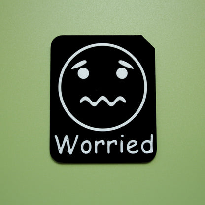 Worried tactile tile - 3D printed raised symbol showing calm face for AAC and SEND communication with vocabulary