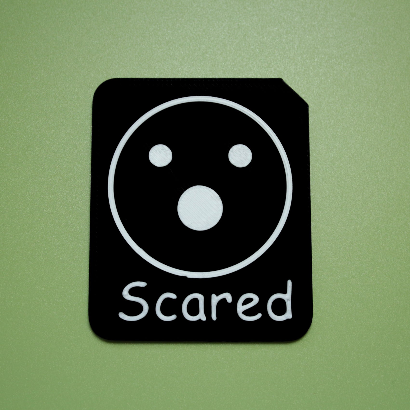 Scared tactile tile - 3D printed raised symbol showing love heart for AAC and SEND communication with vocabulary