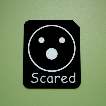 Scared tactile tile - 3D printed raised symbol showing love heart for AAC and SEND communication with vocabulary