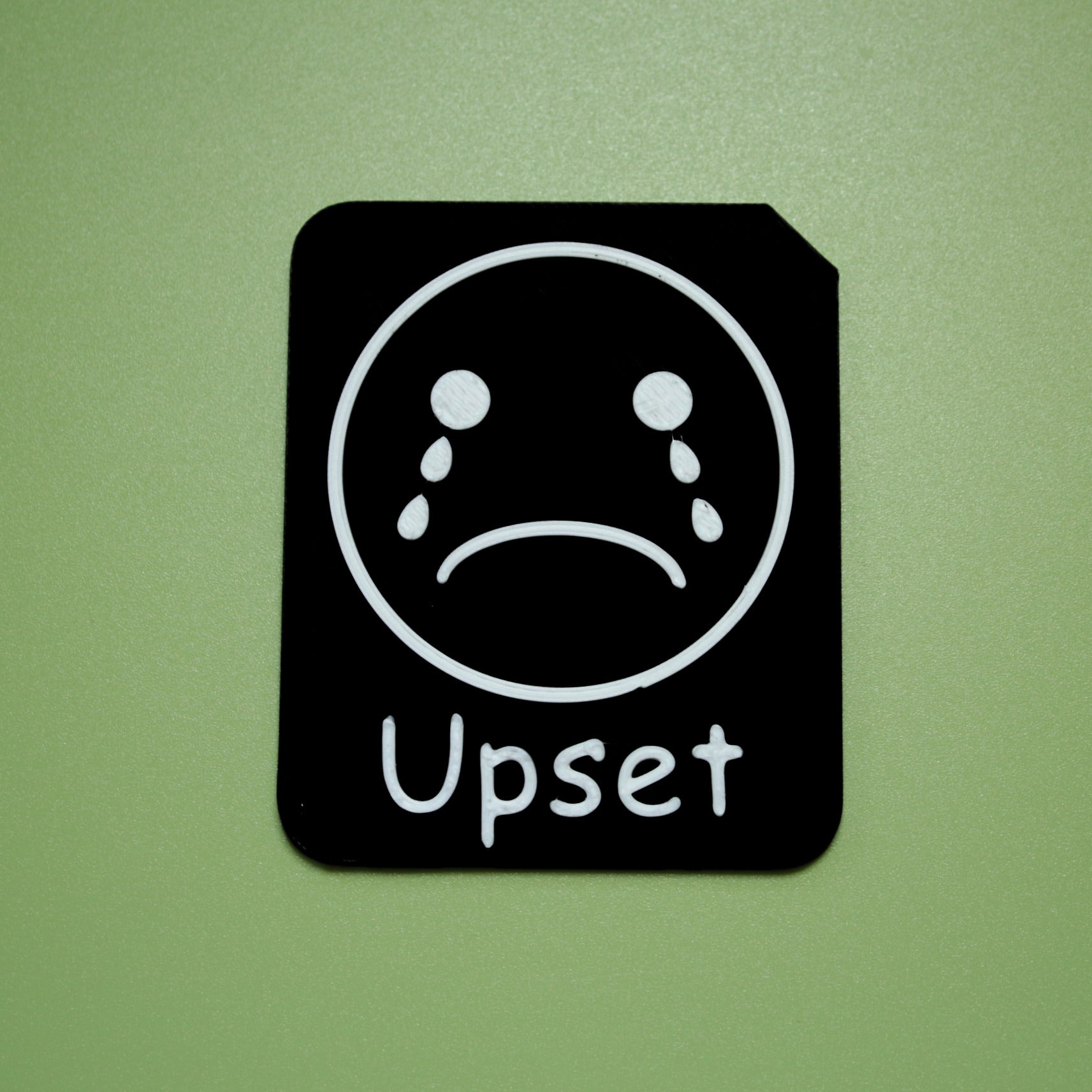 Upset tactile tile - 3D printed raised symbol showing happy face for AAC and SEND communication with vocabulary