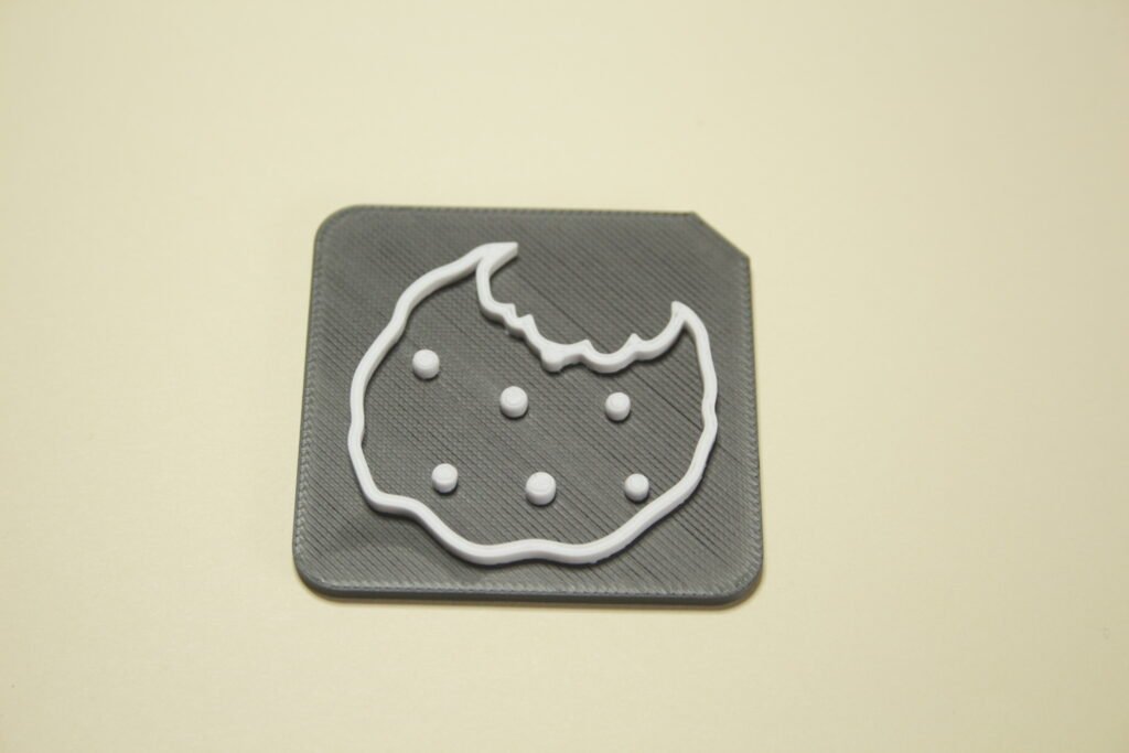 3d printed Tactile Tile showing cookie symbol