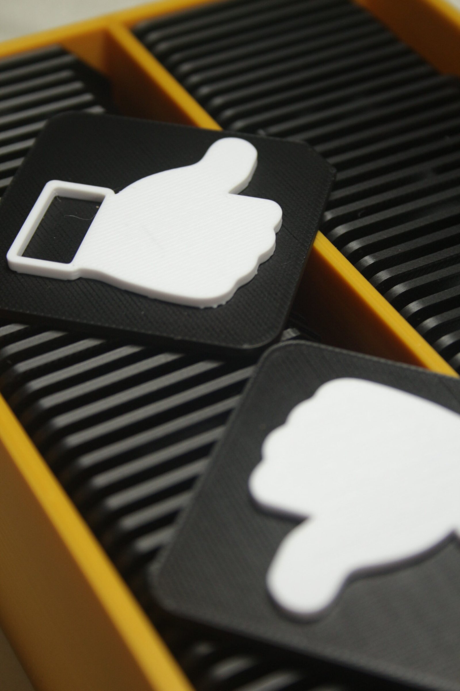 Close up of tactile tiles showing clear raised symbols and cut corner for orientation