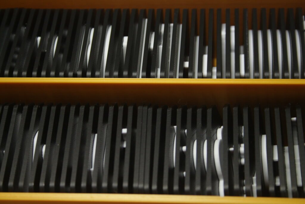 Organised storage of tactile communication tiles in labelled trays